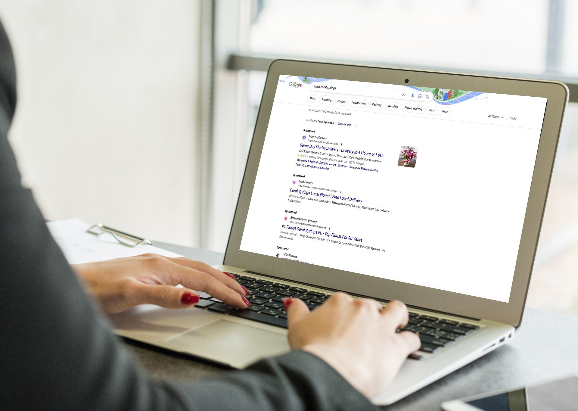 brunette-businesswoman-using-laptop Create, Manage, and Maintain Google and Bing Ad Accounts